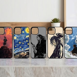 May include: A collection of five phone cases with unique designs. The cases feature artwork depicting a samurai, a starry night scene, and manga-style illustrations. Each case has a black border and a cutout for the camera.