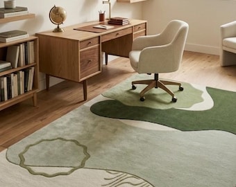 Abstract saliegroen vloerkleed handgetuft modern organisch golvend vloerkleed onregelmatig patroon aangepast tapijt minimalistisch kantoordecor.