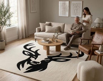 Modern tapijt met hertenkop, handgetuft zwart en crème woonkamertapijt, minimalistisch dierendecor, tapijtmat slaapkamer slaapkamer Wildlife Lodge.