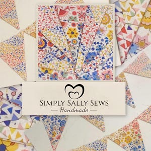May include: A display of fabric bunting and a square card, both featuring floral patterns in various colours. Triangular flags with floral and geometric designs surround the card. The label reads "SIMPLY SALLY SEWS - Handmade".