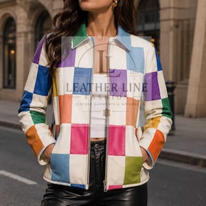May include: A leather jacket featuring a multi-colored checkered pattern in white, blue, green, yellow, purple, and pink squares. The jacket has a collared neckline, a full-length front zipper, and long sleeves. A logo reads LEATHER LINE FASHION.