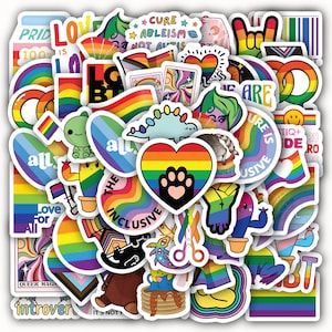 May include: A collection of colorful stickers with various designs, including rainbows, hearts, and text. The stickers feature LGBTQ+ pride symbols and messages of inclusivity. The stickers are in various shapes and sizes.