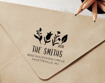 May include: A brown envelope with a black return address stamp. The stamp features a floral design and the text "THE SMITHS 28311 900 SOUTHVIEW CIRCLE FAYETTEVILLE, NC".