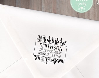 May include: A white envelope with a black and white return address stamp. The stamp features a floral design and the text "SMITHSON 7232 E OVERLOOK DR NASHVILLE TN 37170".