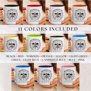 May include: A collection of eleven white ceramic mugs with different colored rims and handles. Each mug features the text "BASGIATH War College" and a crest design. Colors include black, red, maroon, orange, yellow, light green, green, light blue, Cambridge blue, blue, and pink.