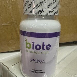 May include: A white bottle of "biote" nutraceutical supplements. The bottle has a purple band and green text. The label reads "DIM SGS+ Hormonet + Detox" and "60 Capsules Dietary Supplement". The top is sealed with a clear plastic wrap.