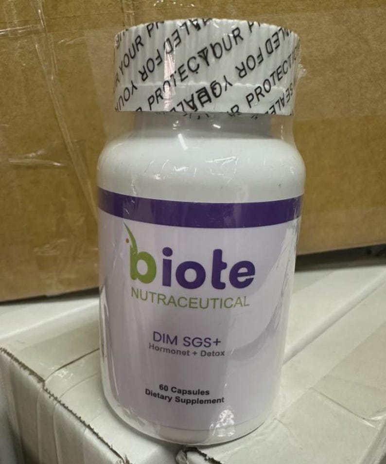 May include: A white bottle of "biote" nutraceutical supplements. The bottle has a purple band and green text. The label reads "DIM SGS+ Hormonet + Detox" and "60 Capsules Dietary Supplement". The top is sealed with a clear plastic wrap.