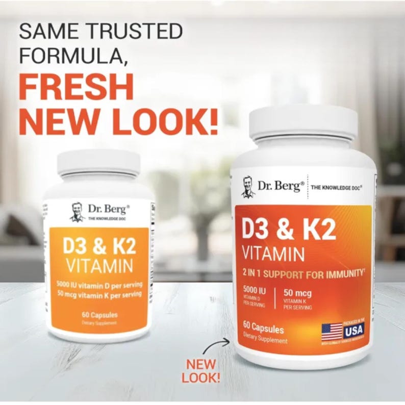 May include: Two white supplement bottles with orange labels. The labels read "D3 & K2 VITAMIN" and include text about vitamin D and K content. The text "SAME TRUSTED FORMULA, FRESH NEW LOOK!" is at the top.