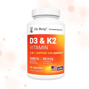 May include: A white bottle of Dr. Berg D3 & K2 Vitamin capsules. The label is orange and yellow with the text "D3 & K2 VITAMIN" and "2 IN 1 SUPPORT FOR IMMUNITY". It also states "5000 IU Vitamin D per serving" and "50 mcg Vitamin K per serving".