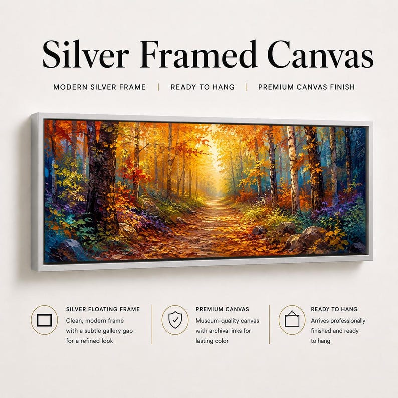 May include: A rectangular canvas print featuring an autumn forest path with vibrant orange, yellow, and red foliage, enclosed in a silver frame. The text reads Silver Framed Canvas, Modern Silver Frame, Ready to Hang, Premium Canvas Finish.