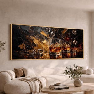 May include: A rectangular wall art print featuring two clear glass tumblers filled with amber liquid and ice cubes. The background is an abstract composition of deep black and metallic gold paint strokes, creating a high-contrast, textured visual effect.
