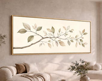 May include: A horizontal rectangular wall art piece featuring a watercolor illustration of a single tree branch with delicate green and beige leaves. The artwork is enclosed in a thin gold frame and is displayed against a neutral-toned wall.