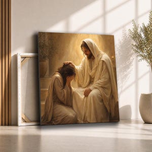 May include: A square canvas print depicting a figure with long hair kneeling and covering their face with hands, while a bearded figure in a light-colored robe sits before them, placing a hand on the kneeling figure's head in a warm, golden light.