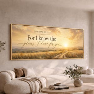 May include: A rectangular wall art piece featuring a golden sunset over a grassy field with a dirt path. The text reads: JEREMIAH 29:11 For I know the plans I have for you. The artwork is enclosed in a thin, light-colored wooden frame.