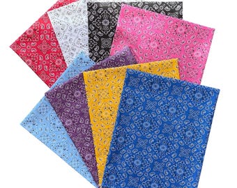 May include: A collection of ten square fabric bandanas featuring a traditional paisley and floral pattern. The set includes various colors such as red, white, black, pink, purple, yellow, light blue, and dark blue, all arranged in a layered fan display.