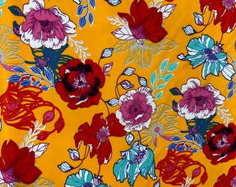 Double Brushed Polyester Knit: Marigold Color Background with Multi Floral By The Yard