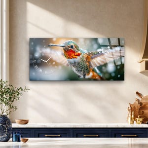 May include: A rectangular wall clock featuring a high-resolution image of a hummingbird with iridescent green and orange feathers in flight. The clock face is overlaid on the left side with white Roman numerals and thin white clock hands.