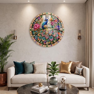 May include: A circular wall clock featuring a vibrant, multi-colored peacock illustration with jewel-toned accents. The clock face displays Roman numerals and thin gold hands, surrounded by a decorative border of embedded faux crystals.