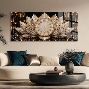 May include: A rectangular wall clock featuring a central circular clock face with gold hands and numerals, surrounded by layered, gold-toned lotus petals encrusted with sparkling crystals, set against a dark, reflective background.