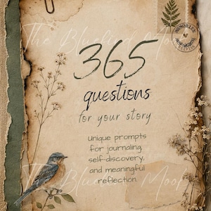 May include: A piece of aged, burnt-edge paper featuring the text 365 questions for your story, unique prompts for journaling, self-discovery, and meaningful reflection. It includes a small blue bird illustration, a fern stamp, and a metal paperclip.