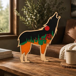 May include: A wooden wolf sculpture in a howling pose, featuring a black sky with a red sun and green and orange forest details. The wolf stands on four legs, with a natural wood finish on the legs and base. The sculpture is displayed on a wooden table.