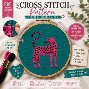 Puede incluir: Un patrón de punto de cruz que muestra un leopardo rosa brillante con manchas negras sobre tela color aguamarina oscuro, sujeto en un bastidor de madera. El diseño incluye texto como CROSS STITCH Pattern, 14 COUNT AQUAMARINE y DIGITAL DOWNLOAD.