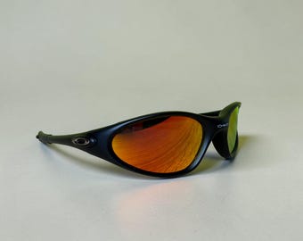 Vintage Oakley Minute-zonnebril zwart oranje lens Y2K Sport wraparound tinten jaren 90 Techwear Streetwear