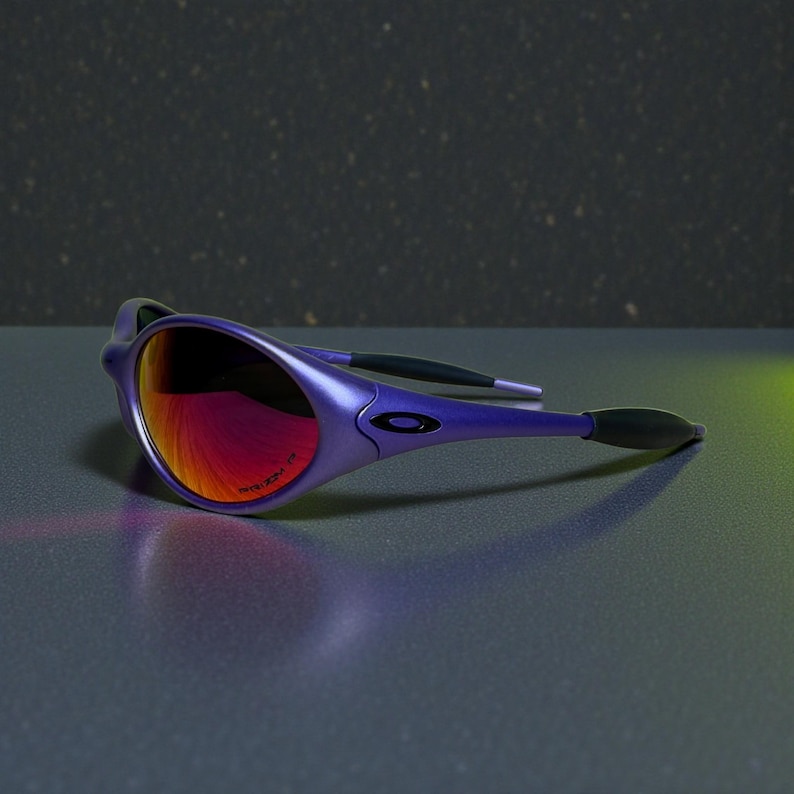 May include: Purple sunglasses with a glossy finish and red-tinted lenses. The sunglasses have a sleek, modern design with a curved frame and the Oakley logo on the temple.