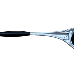 May include: Silver-framed sunglasses with a black arm. The sunglasses have a sleek, modern design. The lenses are dark, and the frame is a metallic silver color. The arm has a black rubber grip.