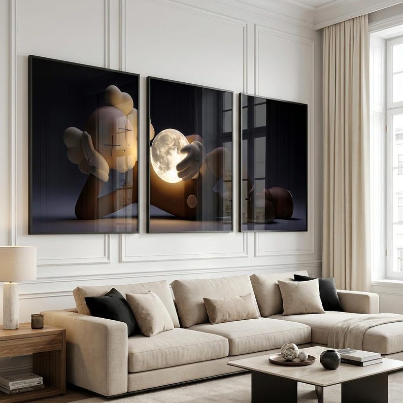 May include: A triptych wall art set featuring a stylized cartoon character with X-shaped eyes and gloved hands. The central panel depicts the character holding a glowing, luminous full moon against a dark, deep background, creating a high-contrast scene.