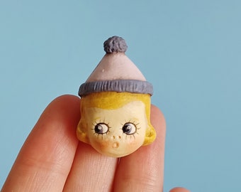 Doll Pin Brooch - Betty Peek a Boo with a Lilac and Blue Bobble Hat