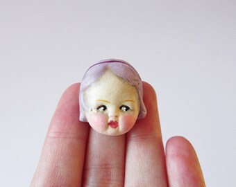 Kitsch Doll Pin Brooch Amber