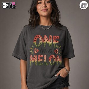 Granite Comfort Colors 1717 oversized t-shirt with One in a Melon summer watermelon design on female model