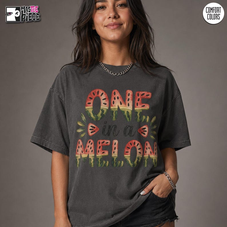 Granite Comfort Colors 1717 oversized t-shirt with One in a Melon summer watermelon design on female model