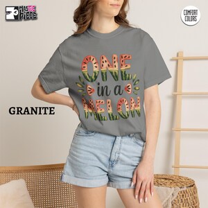 Granite Comfort Colors 1717 t-shirt with summer watermelon graphic, styled with denim shorts on female model