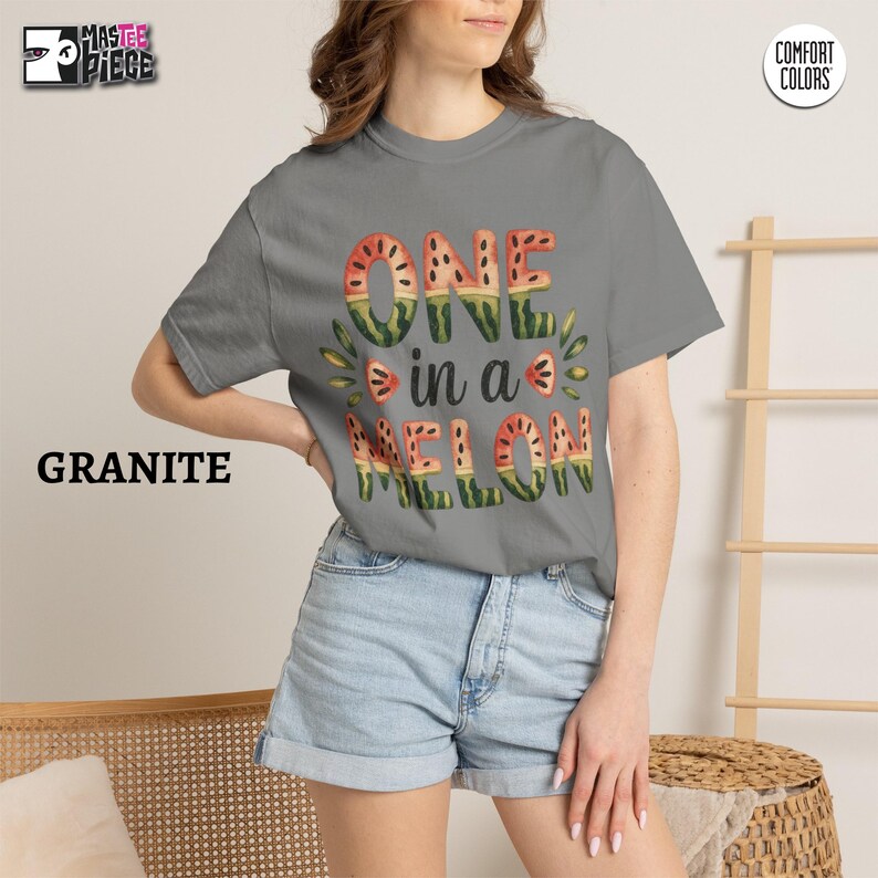 Granite Comfort Colors 1717 t-shirt with summer watermelon graphic, styled with denim shorts on female model