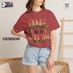 Crimson Comfort Colors 1717 t-shirt with One in a Melon watermelon graphic styled on female model
