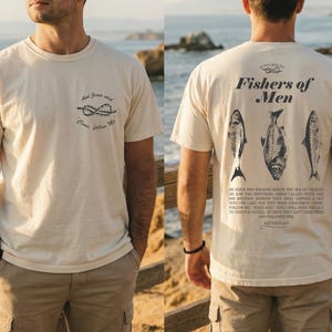 May include: A cream-coloured t-shirt with the text "And Jesus said, Come, follow Me" and a nautical knot design on the front. The back features "Fishers of Men" above three fish illustrations and a Bible verse.