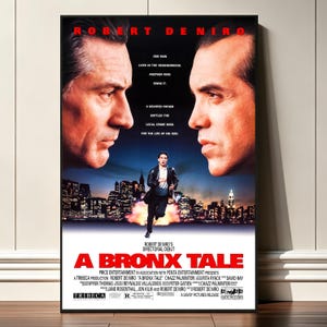 May include: A film poster for A Bronx Tale featuring large profiles of two men facing each other, a man running in front of a city skyline, and the text: One man lives in the neighbourhood. Another man owns it. A devoted father battles the local crime boss.