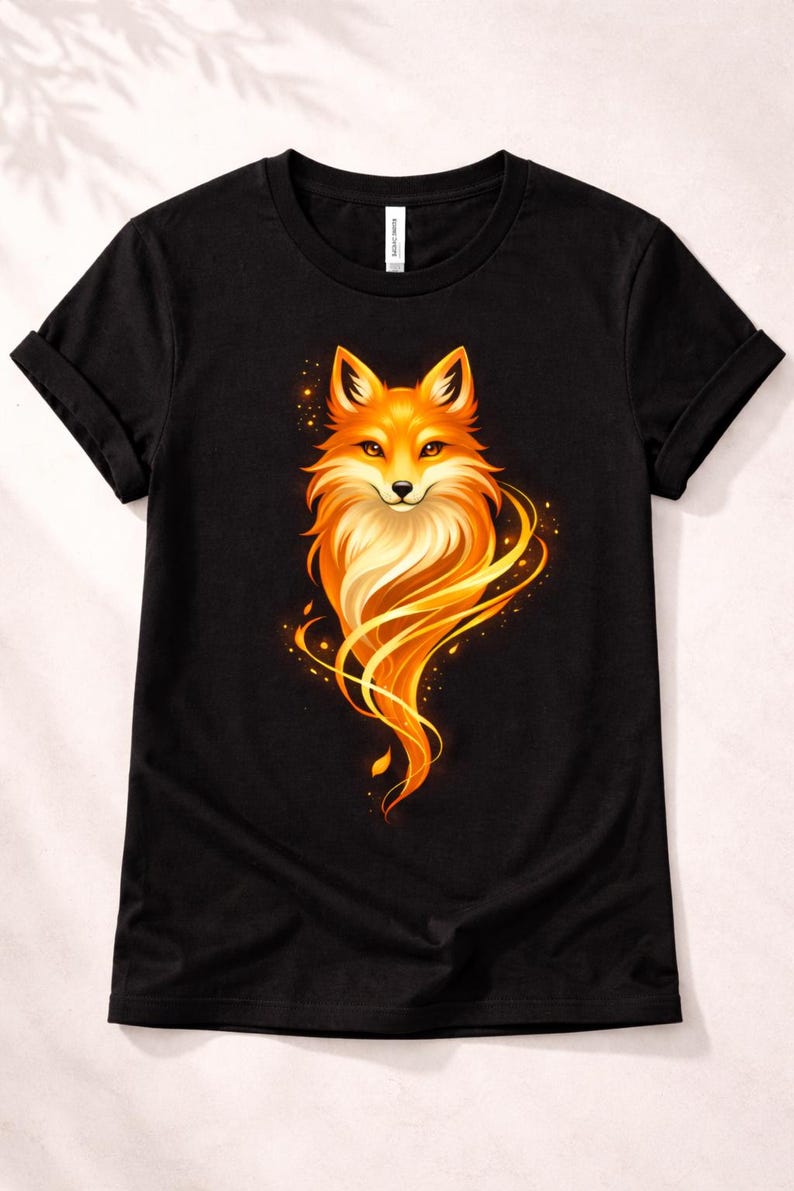 Front view of a black unisex T-shirt with a bold golden fox graphic and luminous flowing orange details.