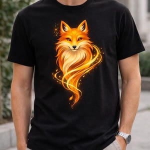 Man wearing a black unisex fox graphic T-shirt with a bold golden fox design printed on the front.