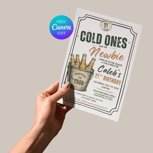 May include: A rectangular birthday invitation card featuring a graphic of beer bottles in a bucket with the text COLD ONES FOR THE Newbie, Caleb's 21ST BIRTHDAY, July 19, 2026, 5:00 PM, Backyard Bar & Grill, 123 Celebration Way, Charleston, SC 29401.