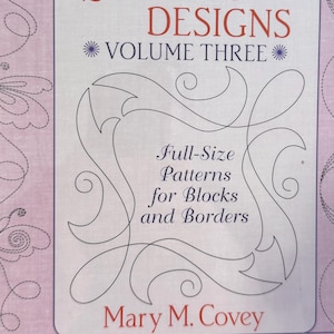 May include: A book cover titled "Follow-the-Line Quilting Designs, Volume Three" with a floral design. The cover features the text "Full-Size Patterns for Blocks and Borders" and the author's name, Mary M. Covey. The background is light pink.