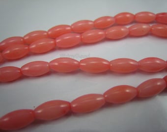 red coral rice bead 8x4mm 15 inch strand