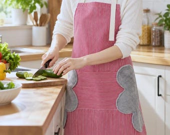 May include: A red and white pinstriped apron featuring two large, gray, cloud-shaped absorbent towel patches sewn onto the front. The apron has white neck straps with a black adjustable buckle and a wide front pocket design.