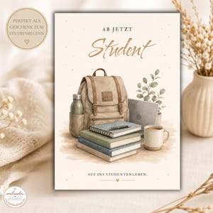 May include: A greeting card featuring a watercolour illustration of a tan backpack, a stack of three books, a laptop, a water bottle, and a coffee mug. The text reads AB JETZT Student and AUF INS STUDENTENLEBEN. The design includes a small heart icon.