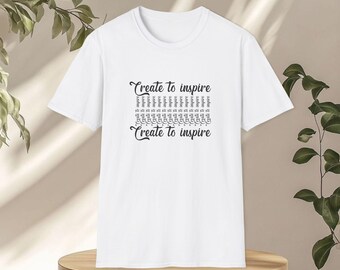 Create to inspire with tower icon on front + "just be" x3 on back. Softstyle 100% ring-spun cotton tee. Breathable, minimalist, ethical.