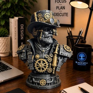 May include: A detailed bust of a bearded figure wearing a top hat adorned with gold-colored gears and goggles. The figure features metallic gray armor plates, additional gear accents, and a cylindrical component on the chest, all set on a circular base.