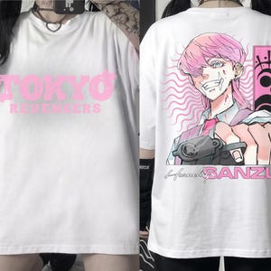 May include: White t-shirt with the text "TOKYO REVENGERS" in pink on the front. The back features a pink-haired anime character holding a gun, with the name "SANZU" and other Japanese text.