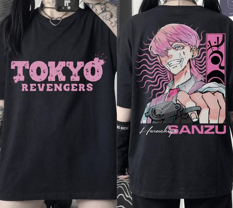 May include: Black t-shirt featuring the text "TOKYO REVENGERS" in pink on the front. The back of the shirt displays an anime-style illustration of a character with pink hair, holding a gun, with the name "Haruchiyo SANZU".